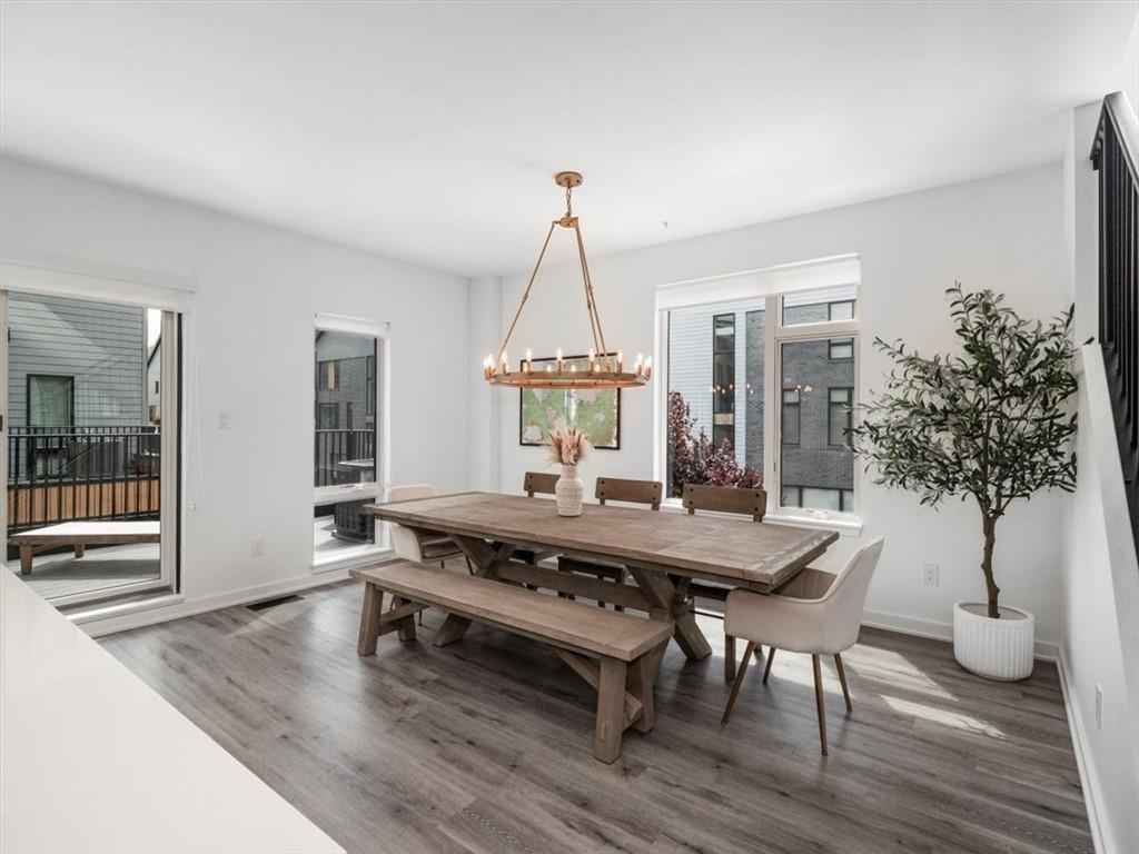 5557 Berlin Way Pittsburgh, PA 15201 - Photo 14 of 34 a view of a dining room with furniture window and wooden floor