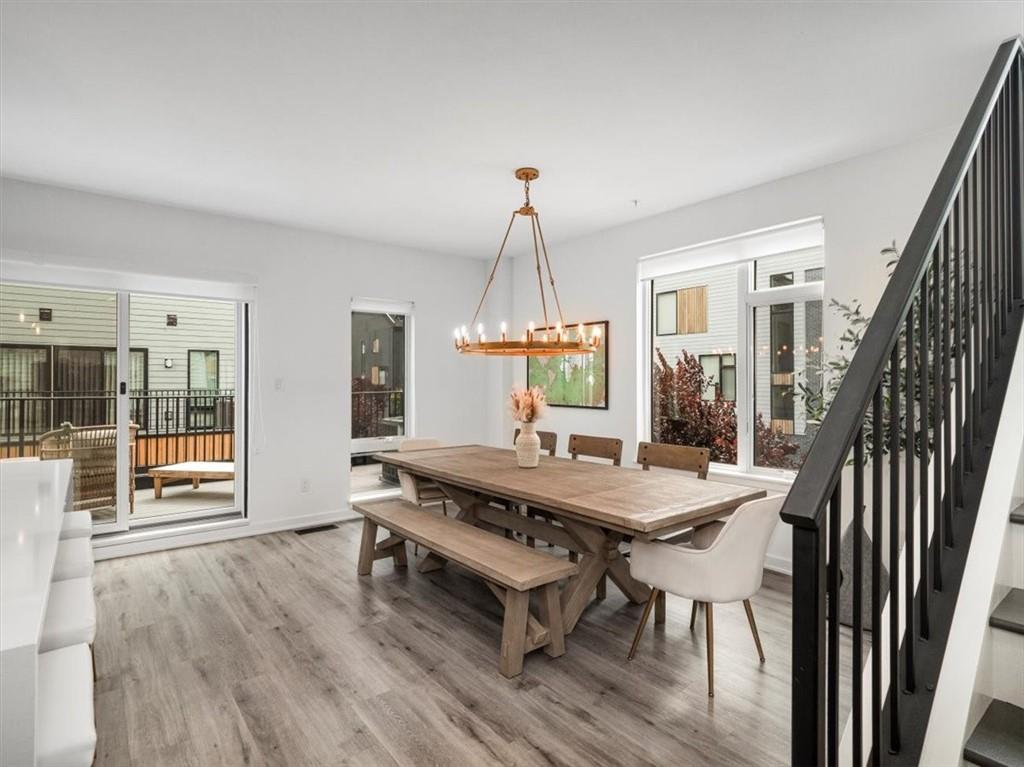 5557 Berlin Way Pittsburgh, PA 15201 - Photo 15 of 34 a view of a dining room with furniture window and wooden floor