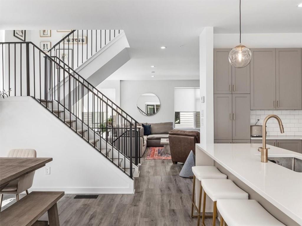 5557 Berlin Way Pittsburgh, PA 15201 - Photo 16 of 34 a very nice looking room with wooden floor and lots of dining room