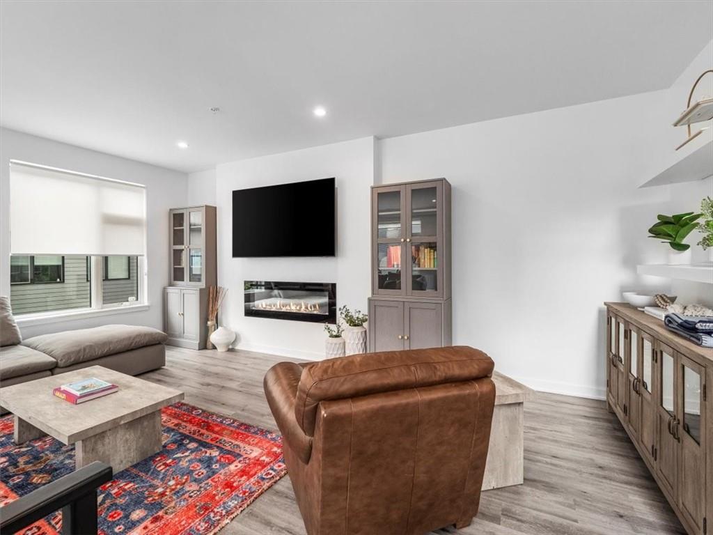 5557 Berlin Way Pittsburgh, PA 15201 - Photo 19 of 34 a living room with furniture and a flat screen tv