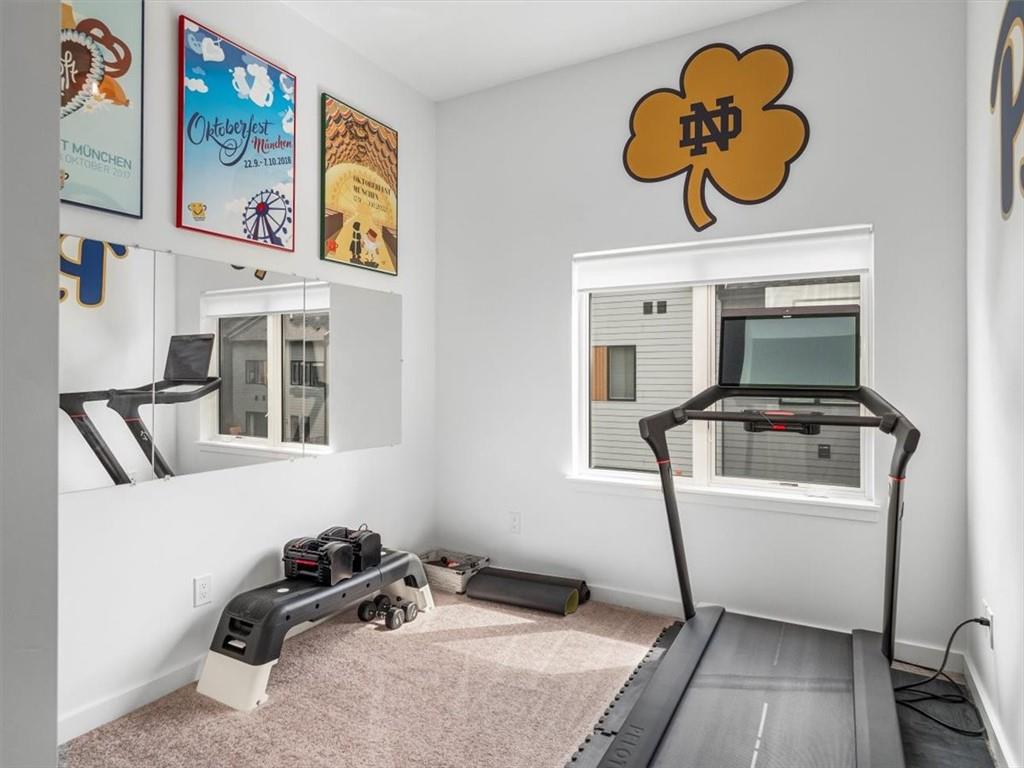 5557 Berlin Way Pittsburgh, PA 15201 - Photo 28 of 34 a room with gym equipment and a mirror