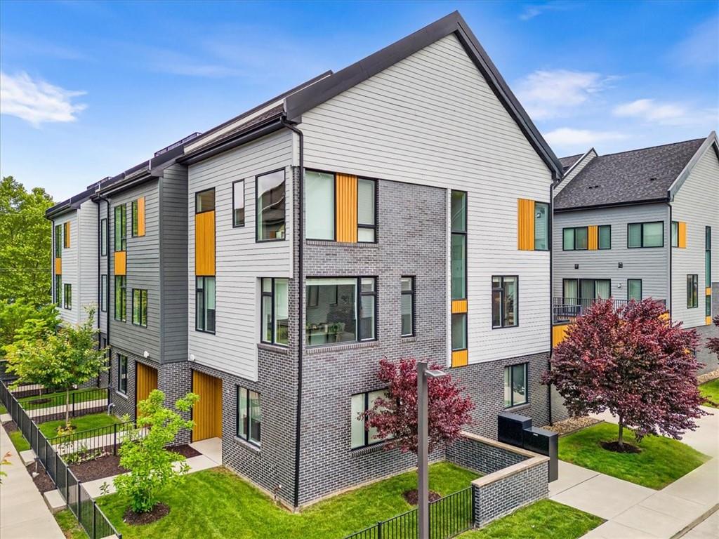 5557 Berlin Way Pittsburgh, PA 15201 - Photo 3 of 34 front view of a house with a yard