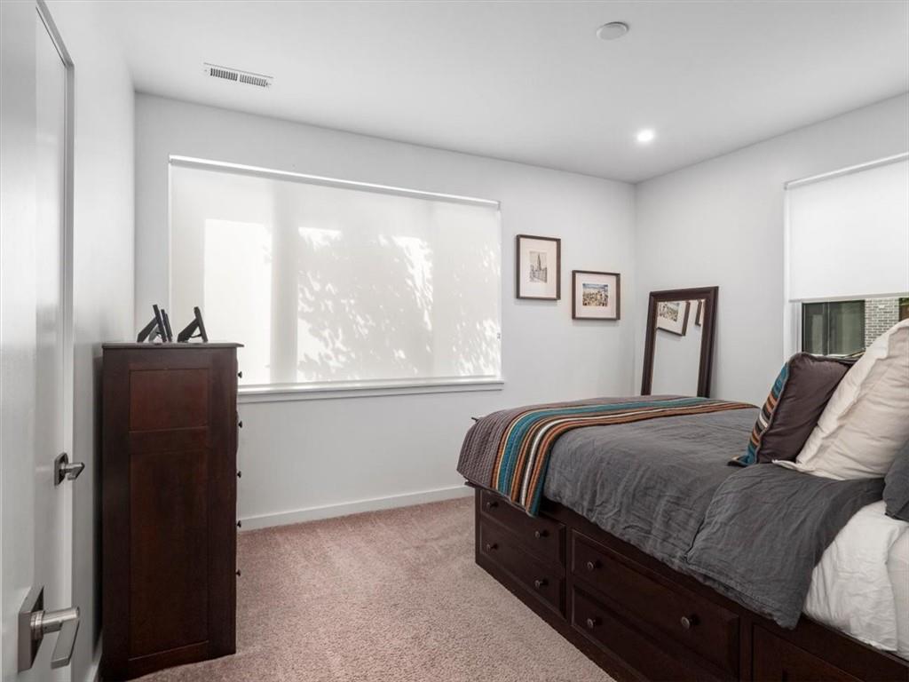 5557 Berlin Way Pittsburgh, PA 15201 - Photo 7 of 34 a bedroom with a bed and wooden floor