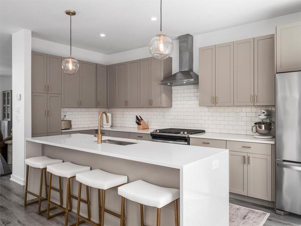 5557 Berlin Way Pittsburgh, PA 15201 - Photo 8 of 34 a kitchen with a sink cabinets and window