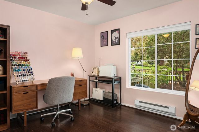 a workspace with furniture and a window