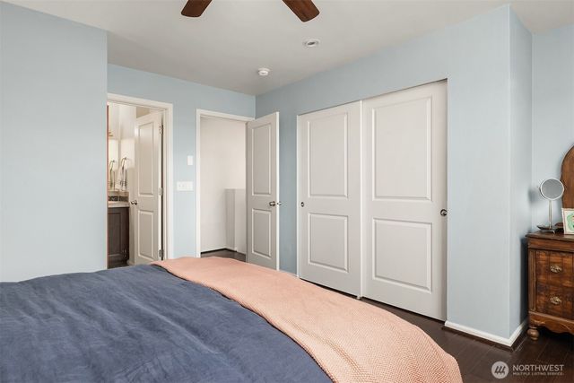 a bedroom with a bed and a tv