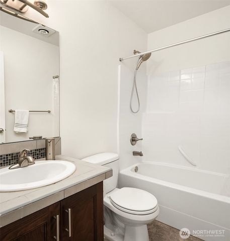 a bathroom with a sink a toilet and a bathtub