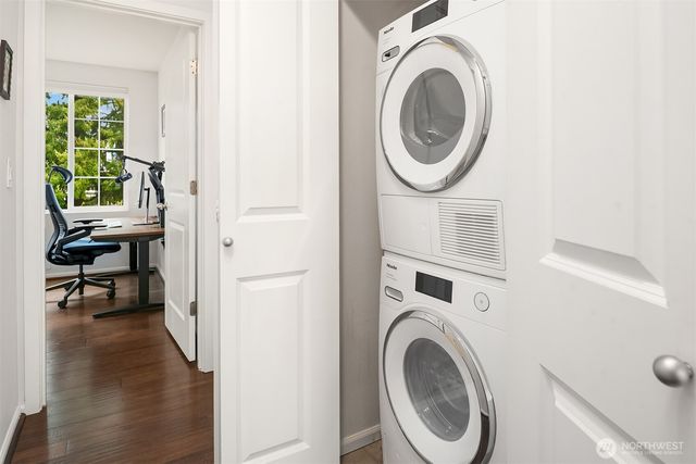 a view of a bedroom with washer and dryer