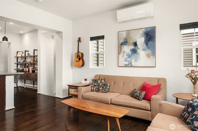 a living room with furniture and a window