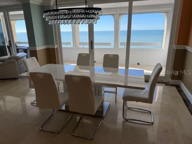 a view of a dining room with furniture window and outside view