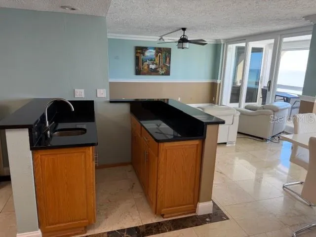 a kitchen with stainless steel appliances granite countertop a stove and a refrigerator