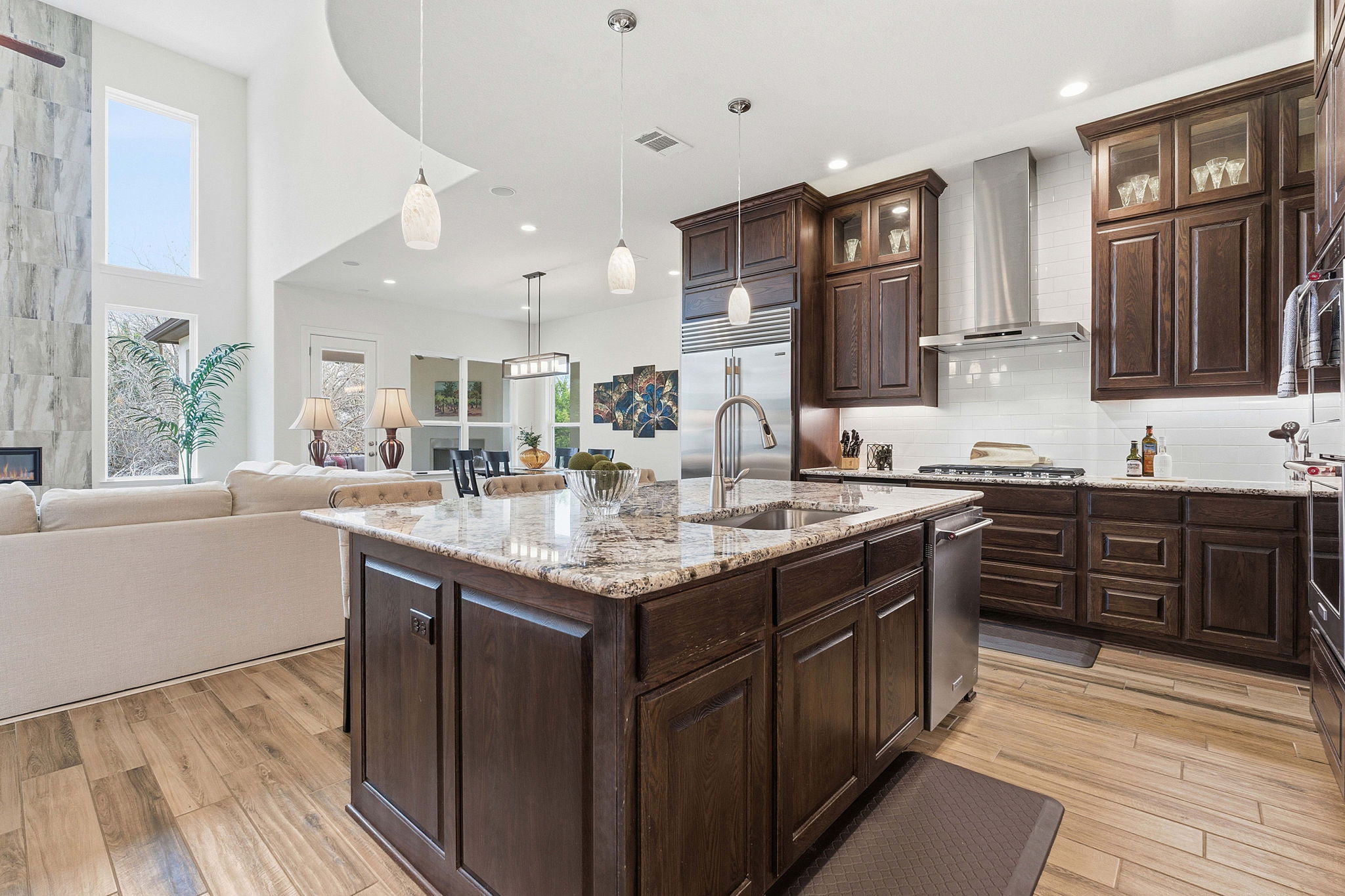 2824 Wedgescale Pass Leander, TX 78641 - Photo 13 of 40 The kitchen opens to the living room and dining area with ease