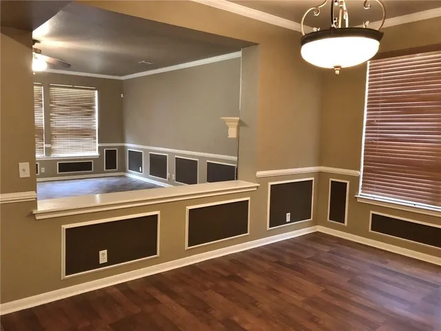 a kitchen with stainless steel appliances granite countertop a stove and a microwave