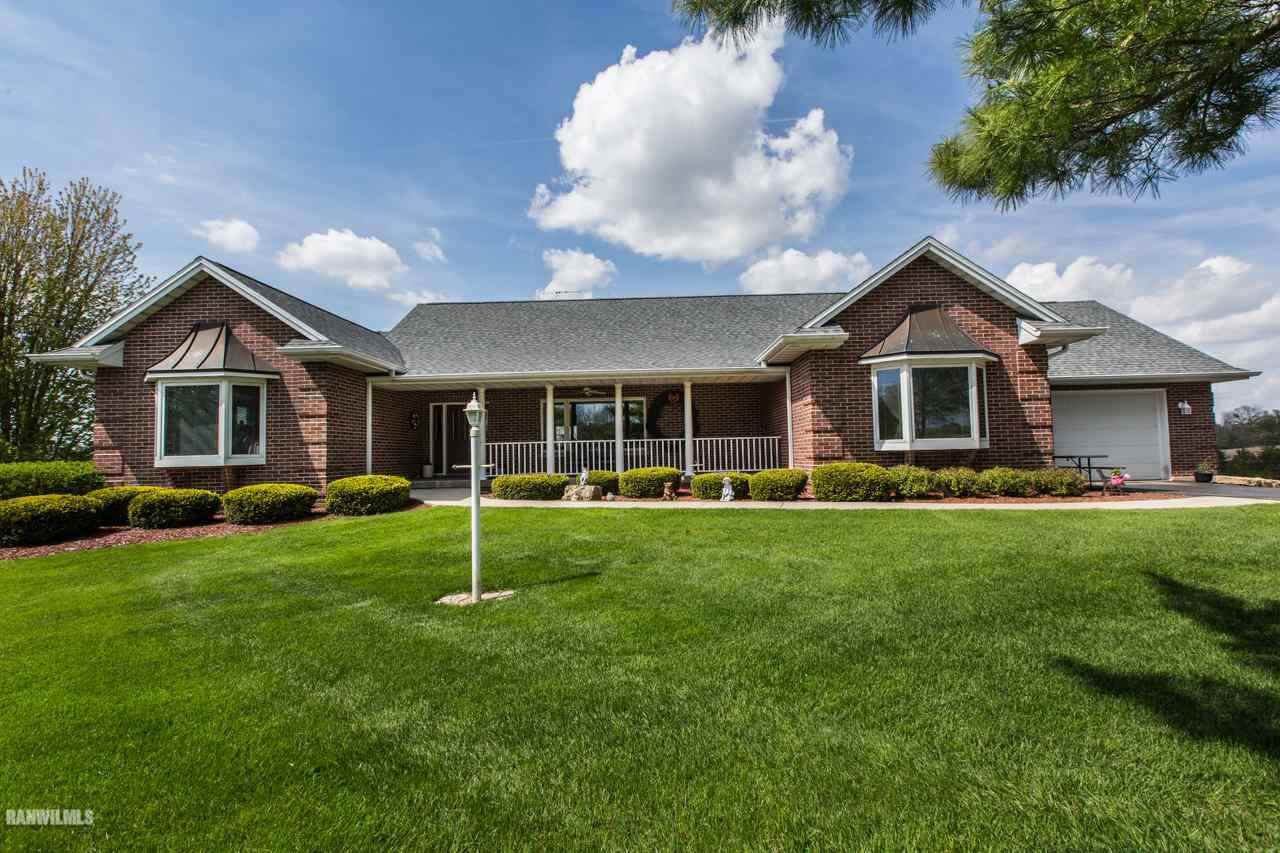 5920 East Townsend Road Stockton, IL 61085 - Photo 1 of 10 a house with a big yard and large trees