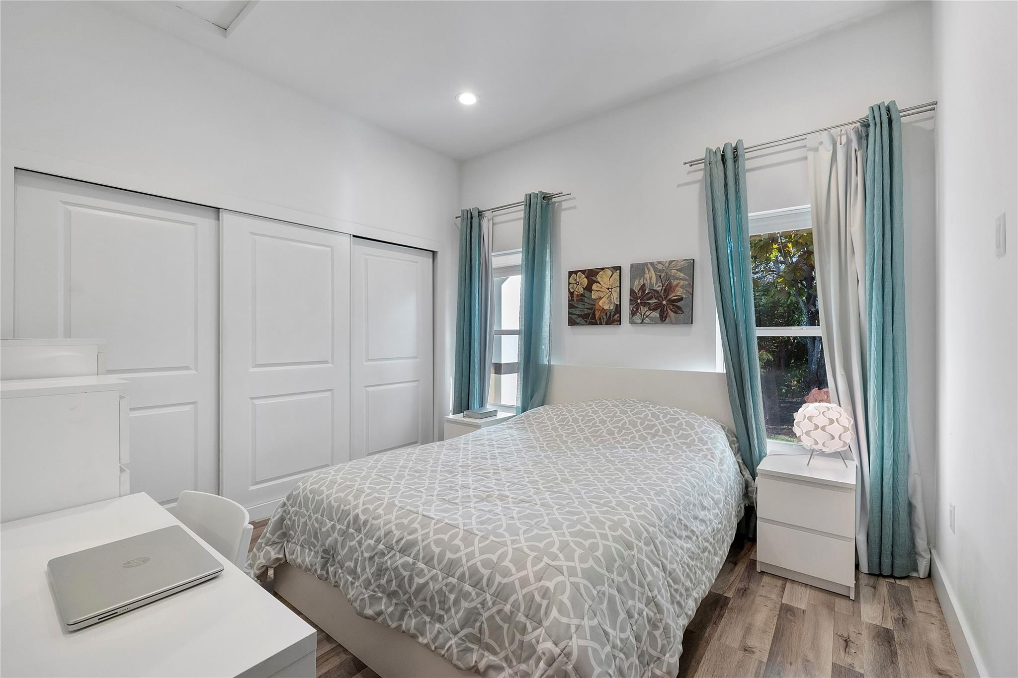 5351 Godfrey Road Parkland, FL 33067 - Photo 77 of 95 a bedroom with a bed and a mirror