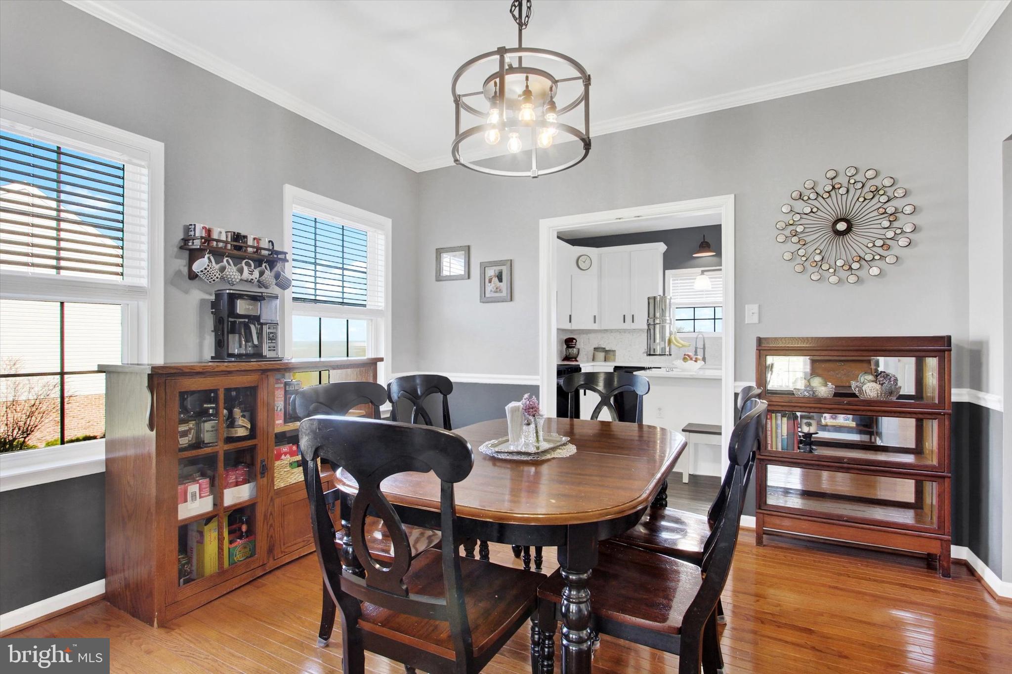 123 Colton Court Smithsburg, MD 21783 - Photo 12 of 60 a view of a dining room with furniture window and wooden floor