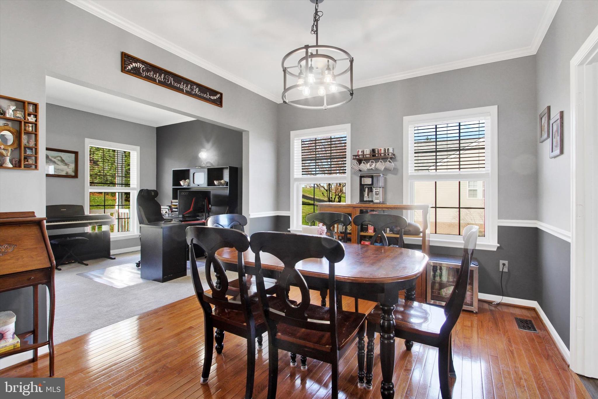 123 Colton Court Smithsburg, MD 21783 - Photo 13 of 60 a view of a dining room with furniture window and wooden floor