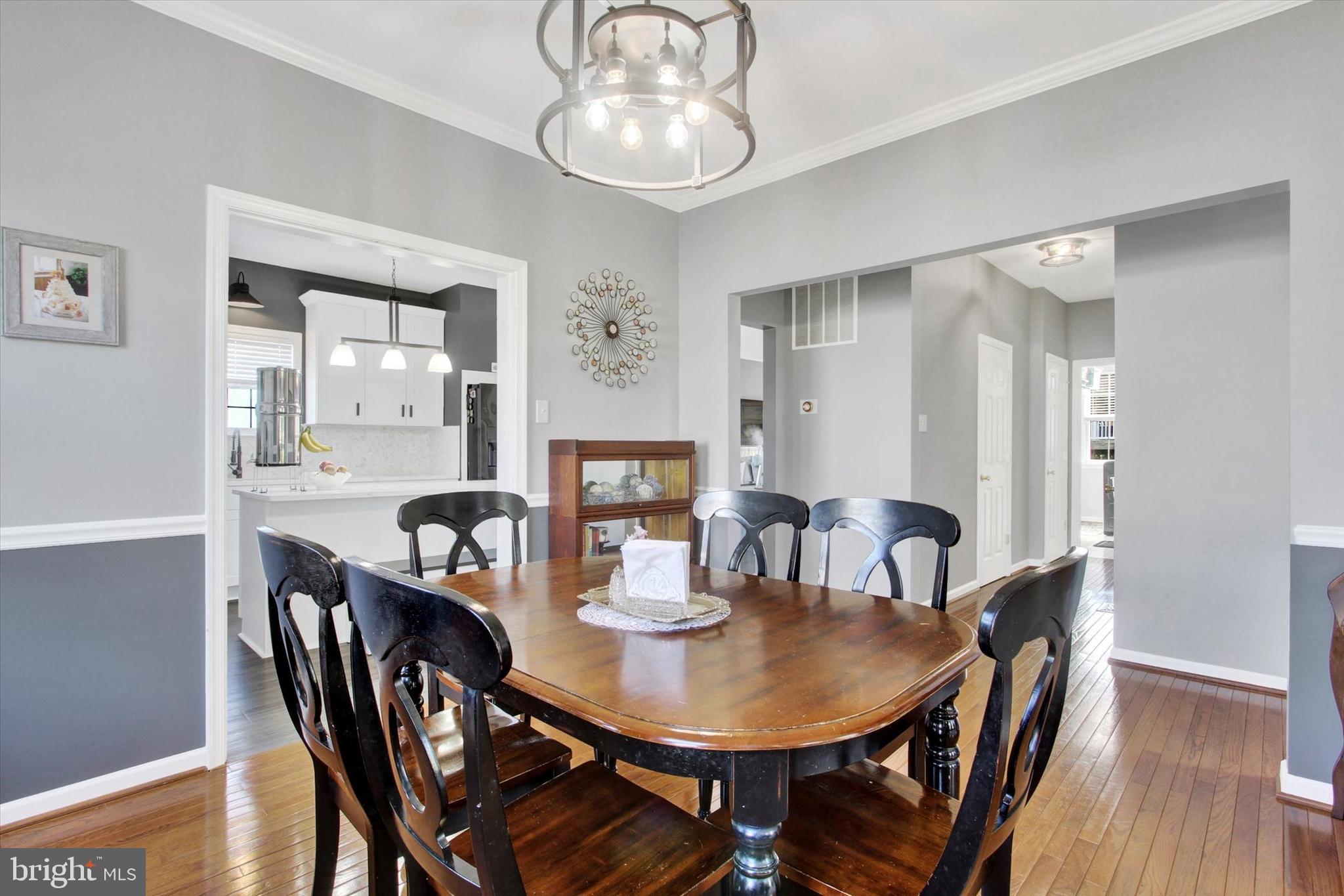 123 Colton Court Smithsburg, MD 21783 - Photo 14 of 60 a view of a dining room with furniture window and wooden floor