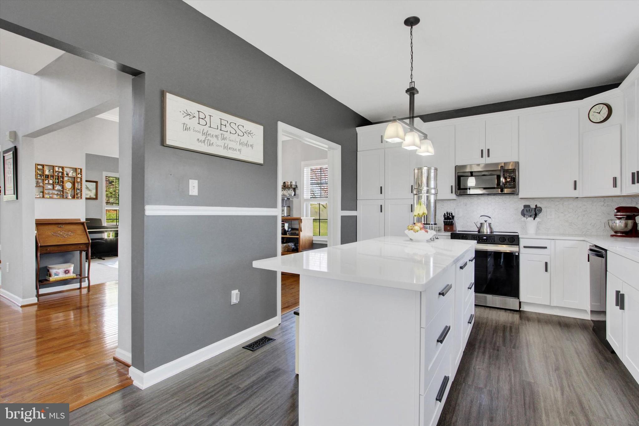 123 Colton Court Smithsburg, MD 21783 - Photo 15 of 60 a kitchen with stainless steel appliances granite countertop a refrigerator a oven a sink dishwasher and white cabinets with wooden floor
