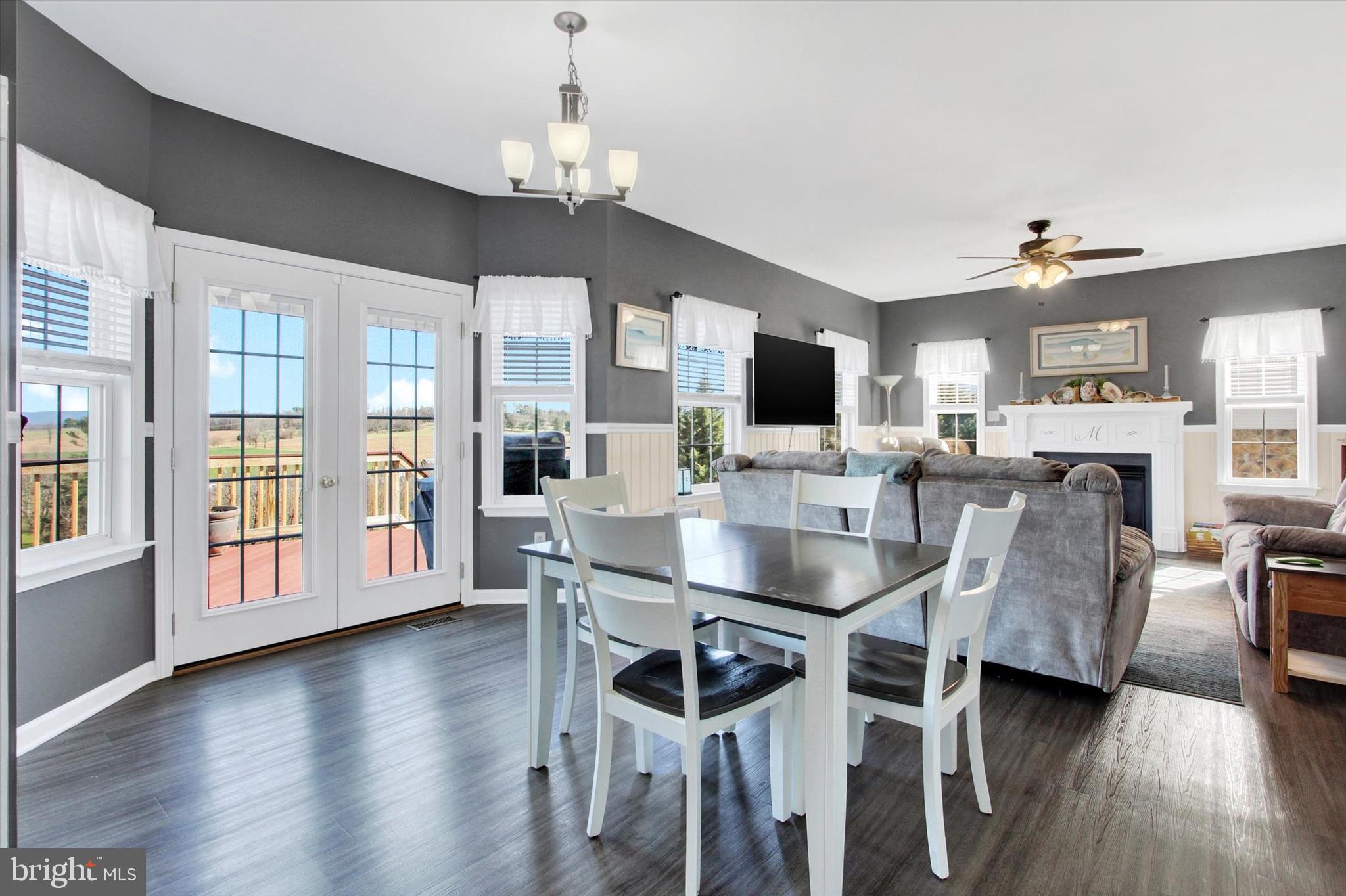 123 Colton Court Smithsburg, MD 21783 - Photo 18 of 60 a view of a dining room with furniture wooden floor and chandelier