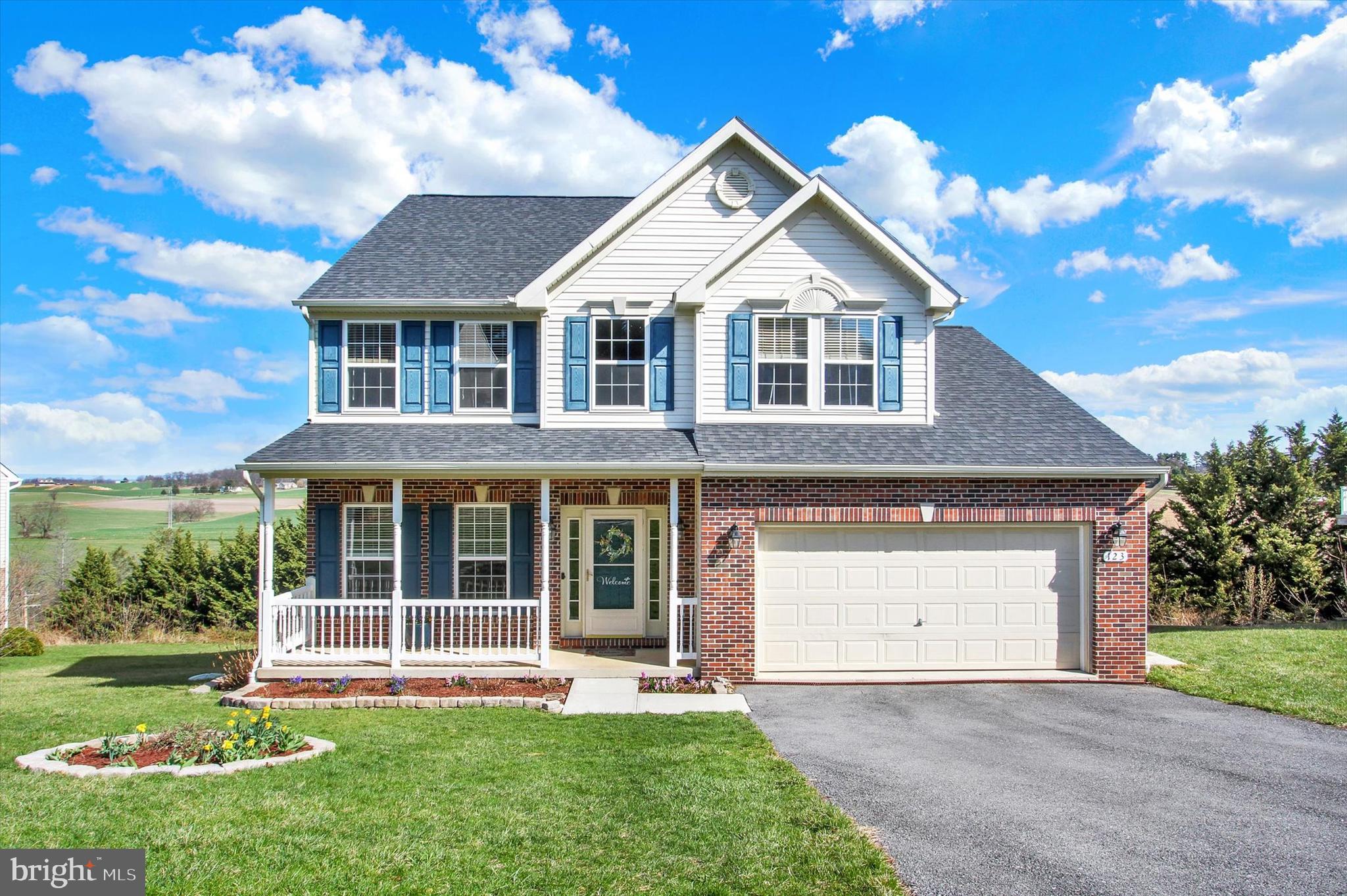 123 Colton Court Smithsburg, MD 21783 - Photo 2 of 60 a front view of a house with a yard and garage