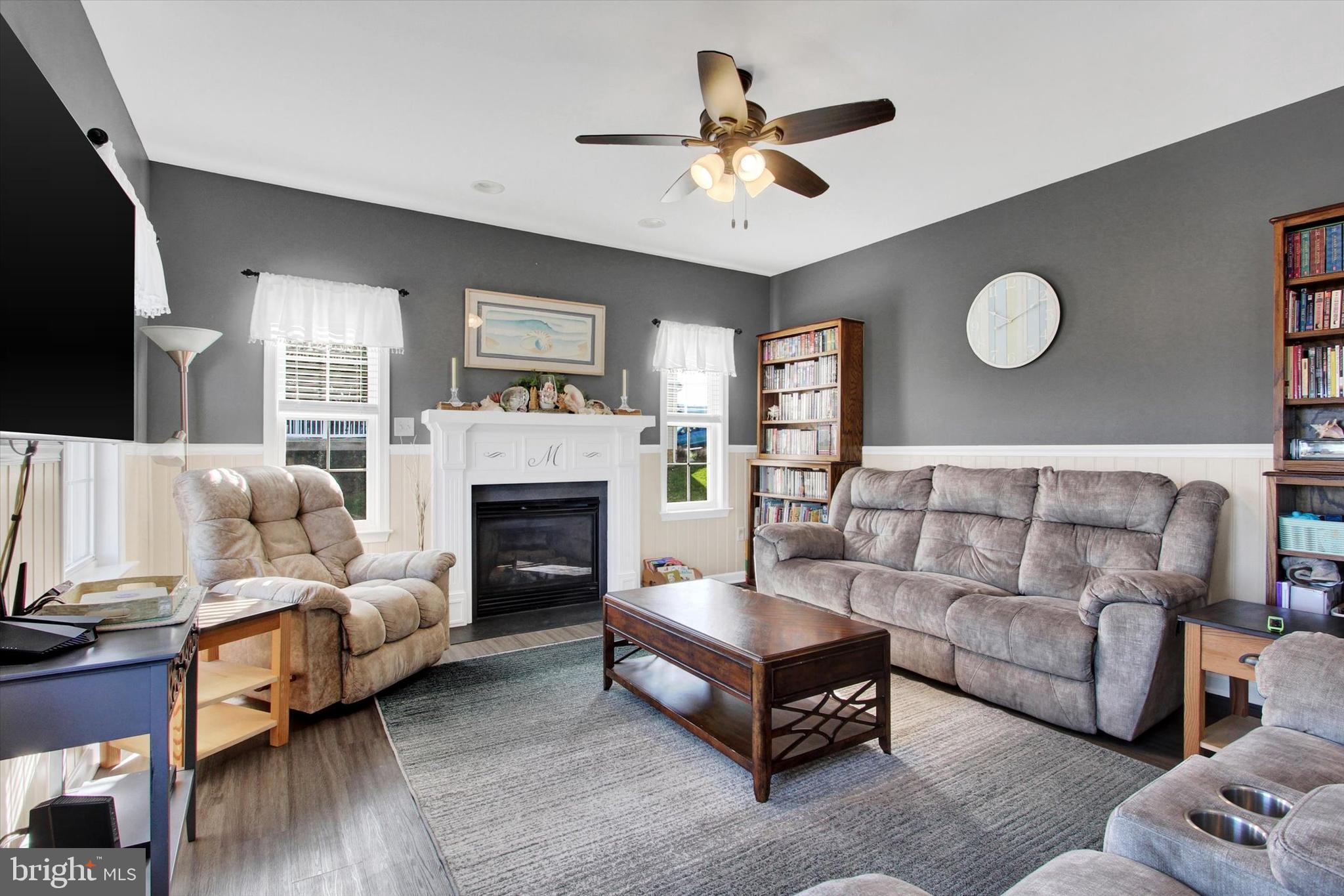 123 Colton Court Smithsburg, MD 21783 - Photo 21 of 60 a living room with furniture a fireplace and a flat screen tv