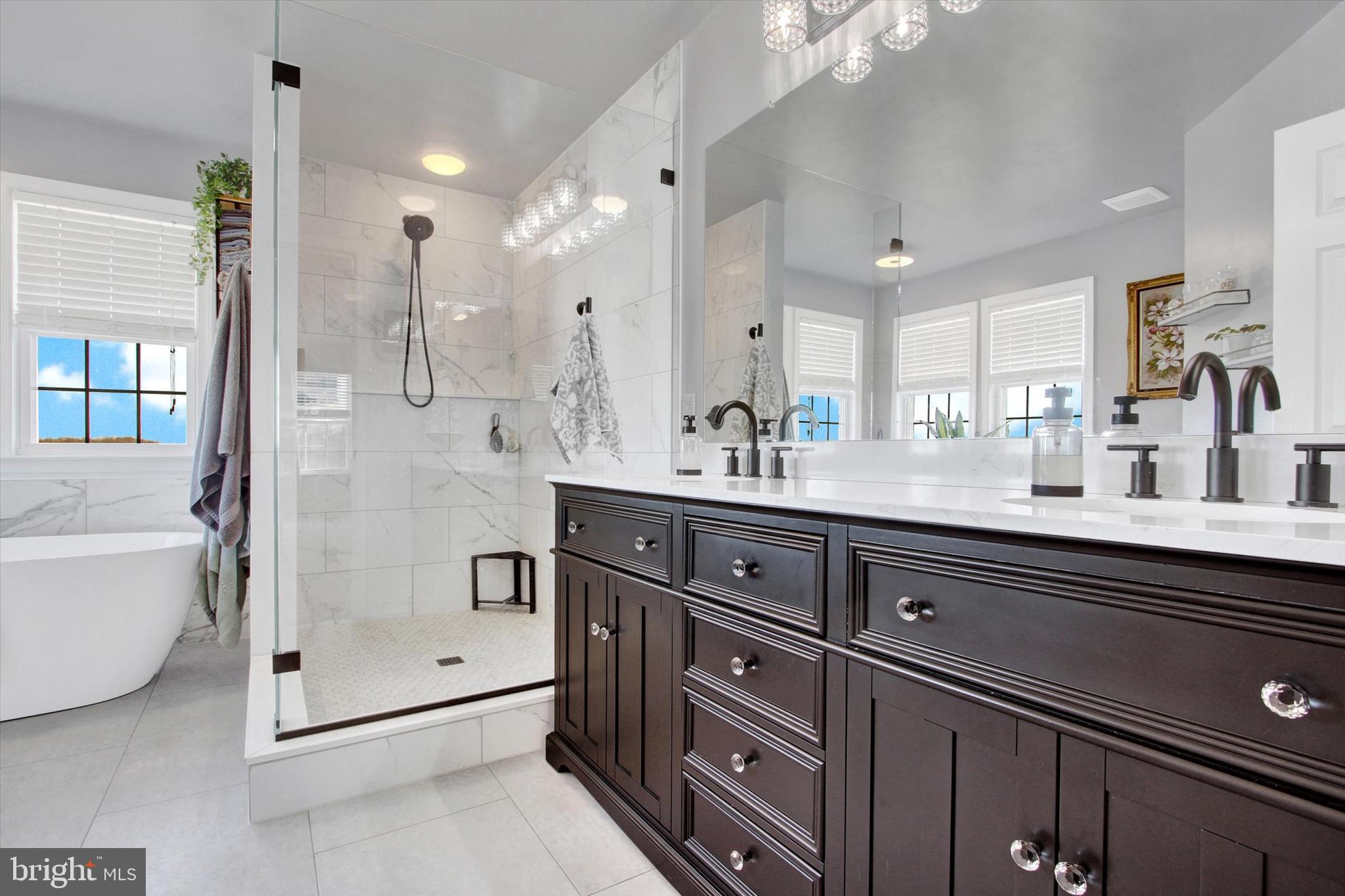 123 Colton Court Smithsburg, MD 21783 - Photo 28 of 60 a bathroom with a double vanity sink mirror and shower