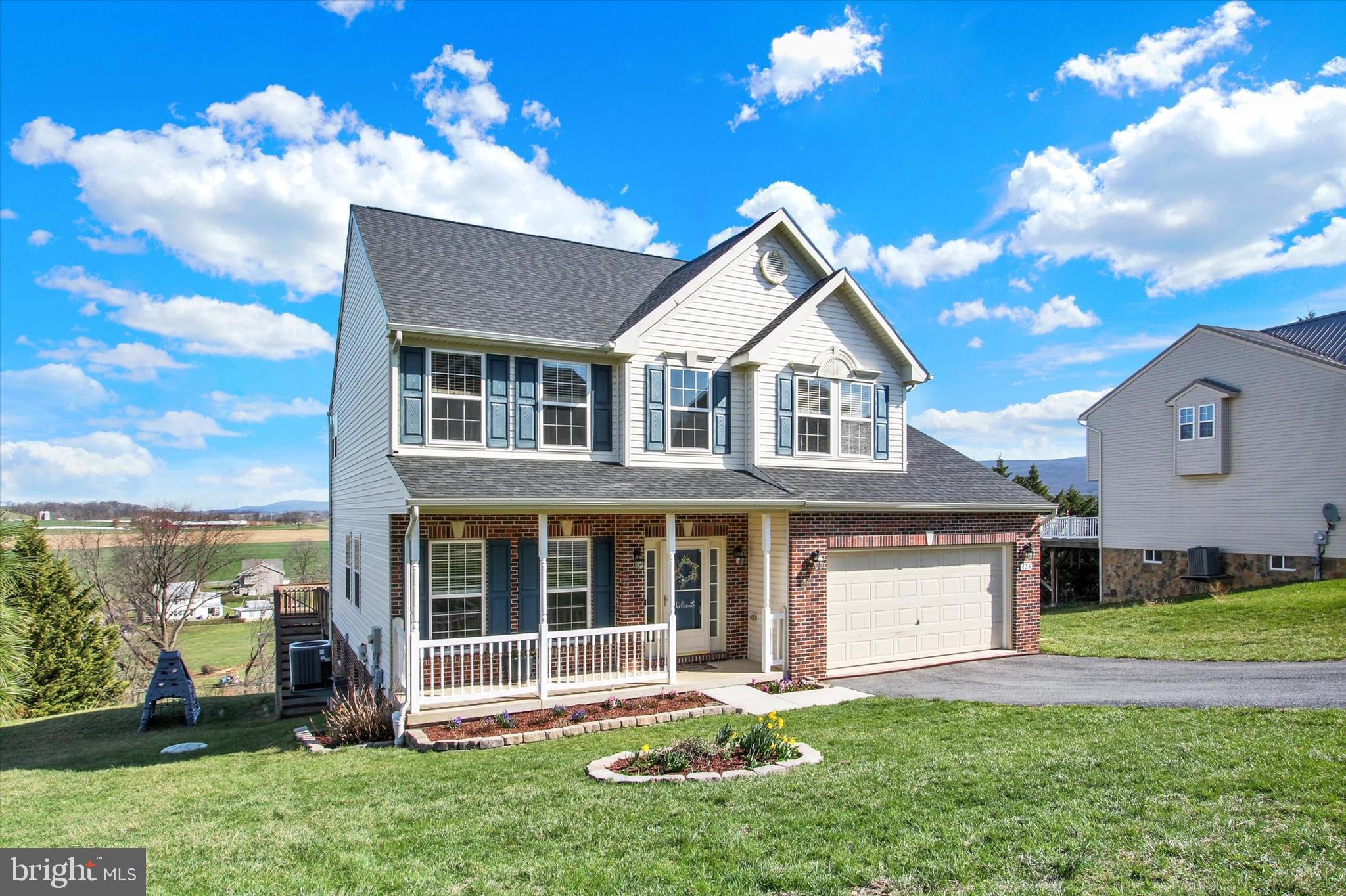 123 Colton Court Smithsburg, MD 21783 - Photo 3 of 60 a front view of a house with a yard