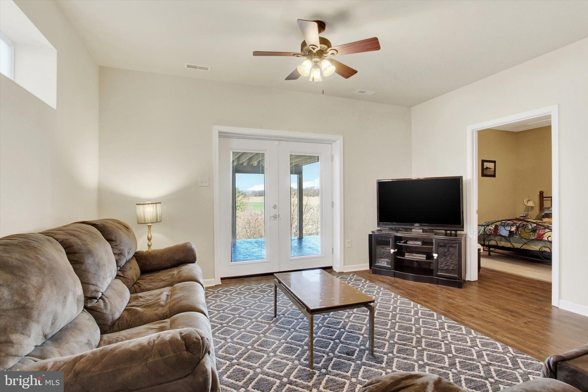 123 Colton Court Smithsburg, MD 21783 - Photo 35 of 60 a living room with furniture and a flat screen tv
