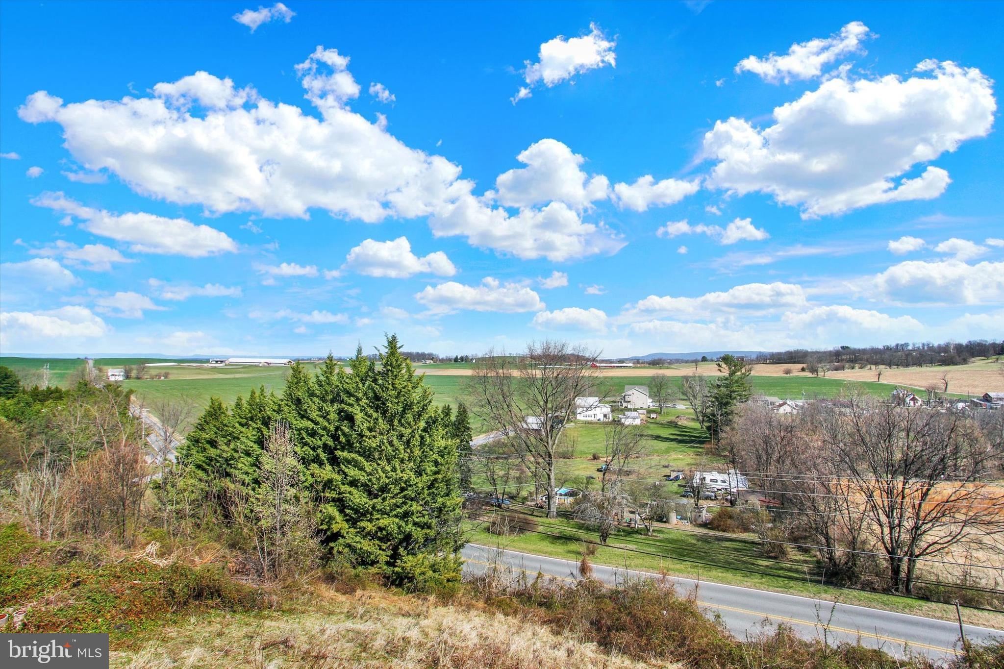 123 Colton Court Smithsburg, MD 21783 - Photo 46 of 60 a view of a lake with a yard