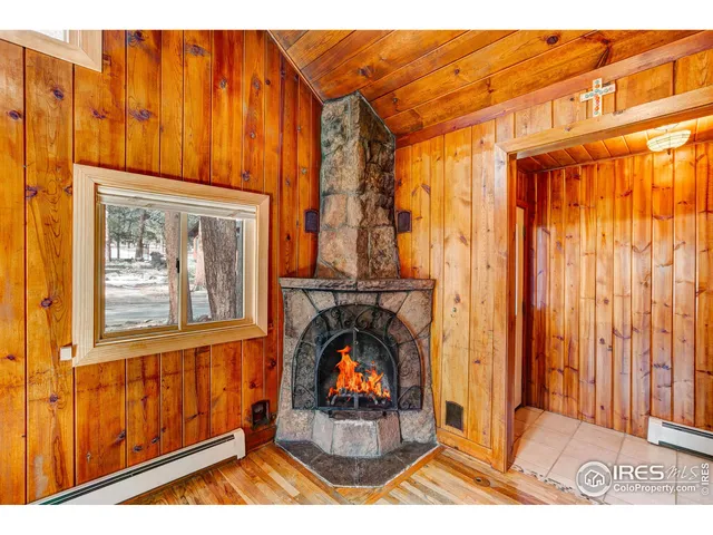 a view of a livingroom with furniture and staircase