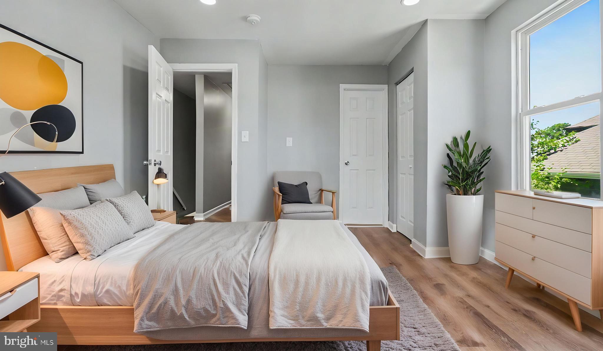 4203 Shell Street Capitol Heights, MD 20743 - Photo 10 of 47 a bedroom with a bed and a potted plant