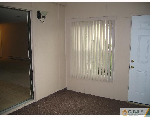 32 A Haddon Road Monroe Township, NJ 08831 - Photo 4 of 8 a view of an empty room with a window