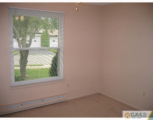 32 A Haddon Road Monroe Township, NJ 08831 - Photo 5 of 8 a view of a window in an empty room