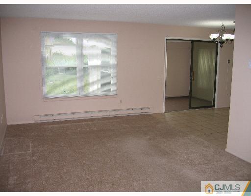 32 A Haddon Road Monroe Township, NJ 08831 - Photo 7 of 8 a view of an empty room with a window