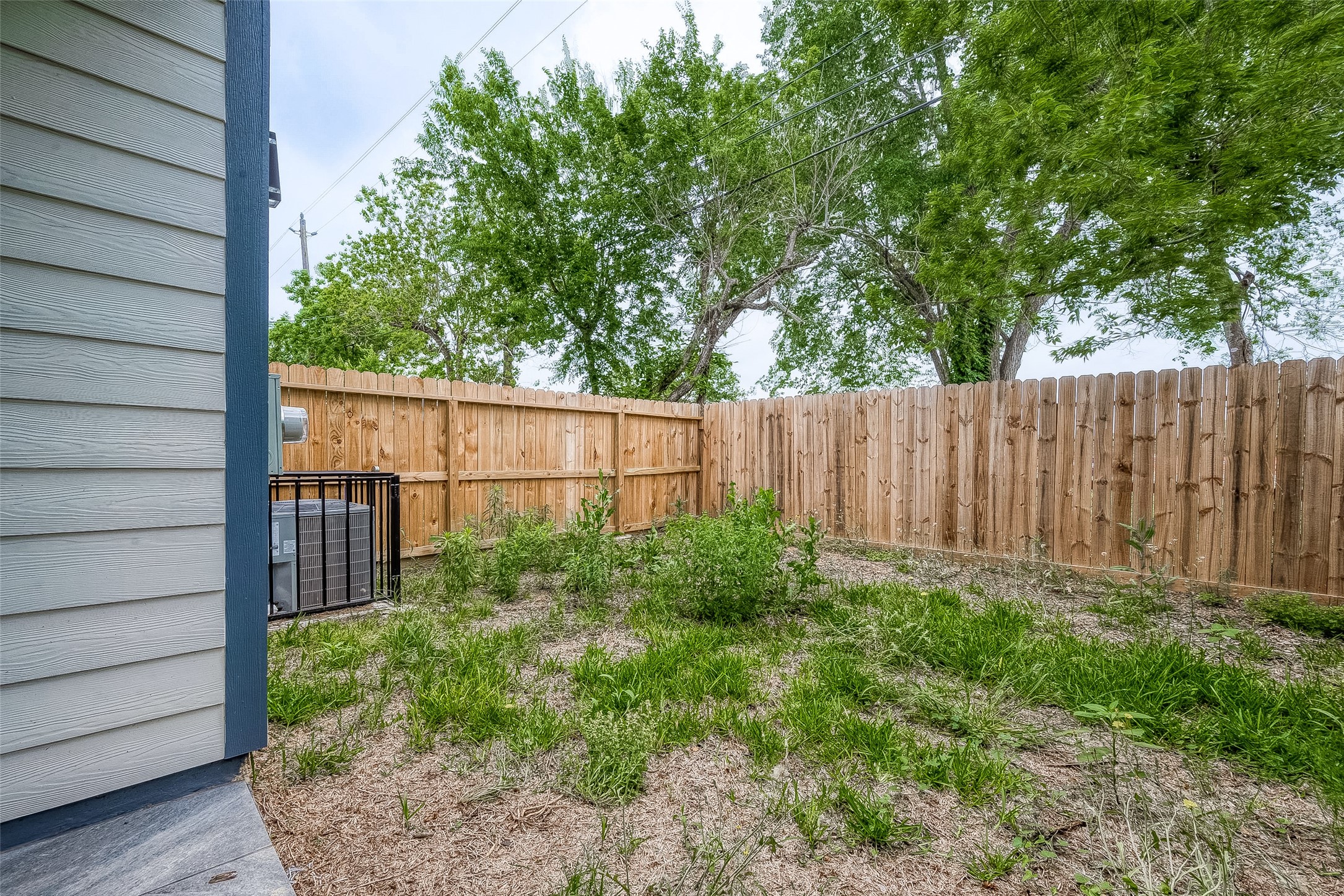 7108 St Augustine Street Houston, TX 77021 - Photo 20 of 21 a view of outdoor space with wooden fence