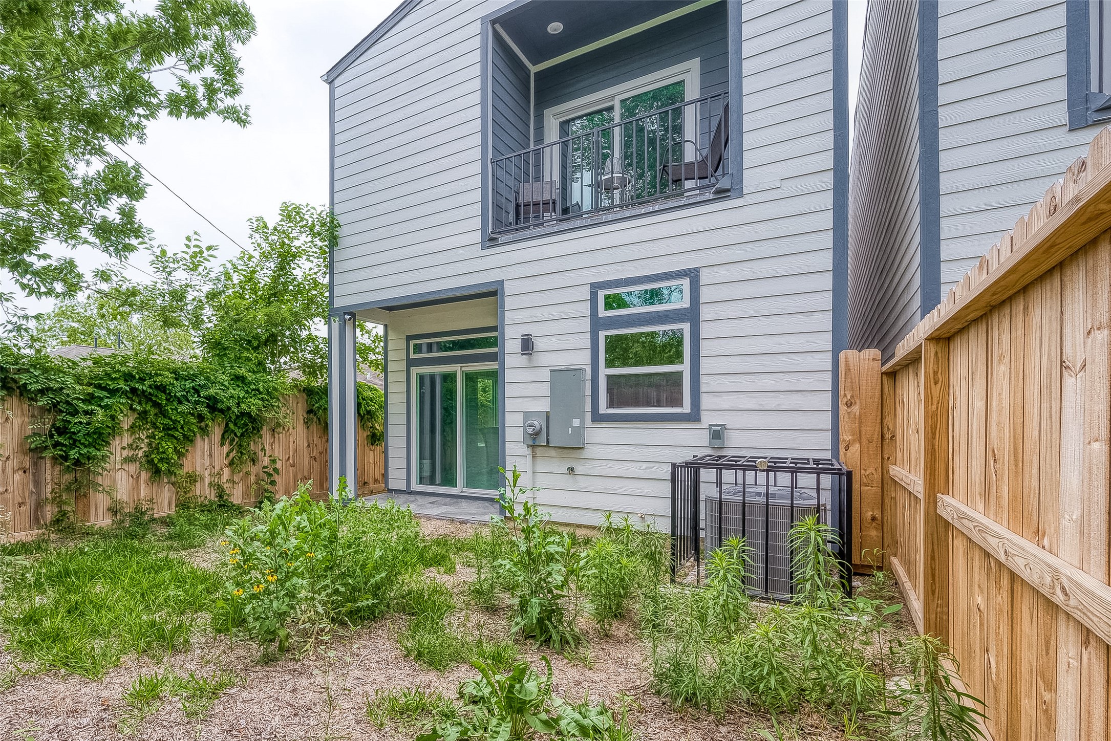 7108 St Augustine Street Houston, TX 77021 - Photo 21 of 21 a view of a house with potted plants and a table and chair