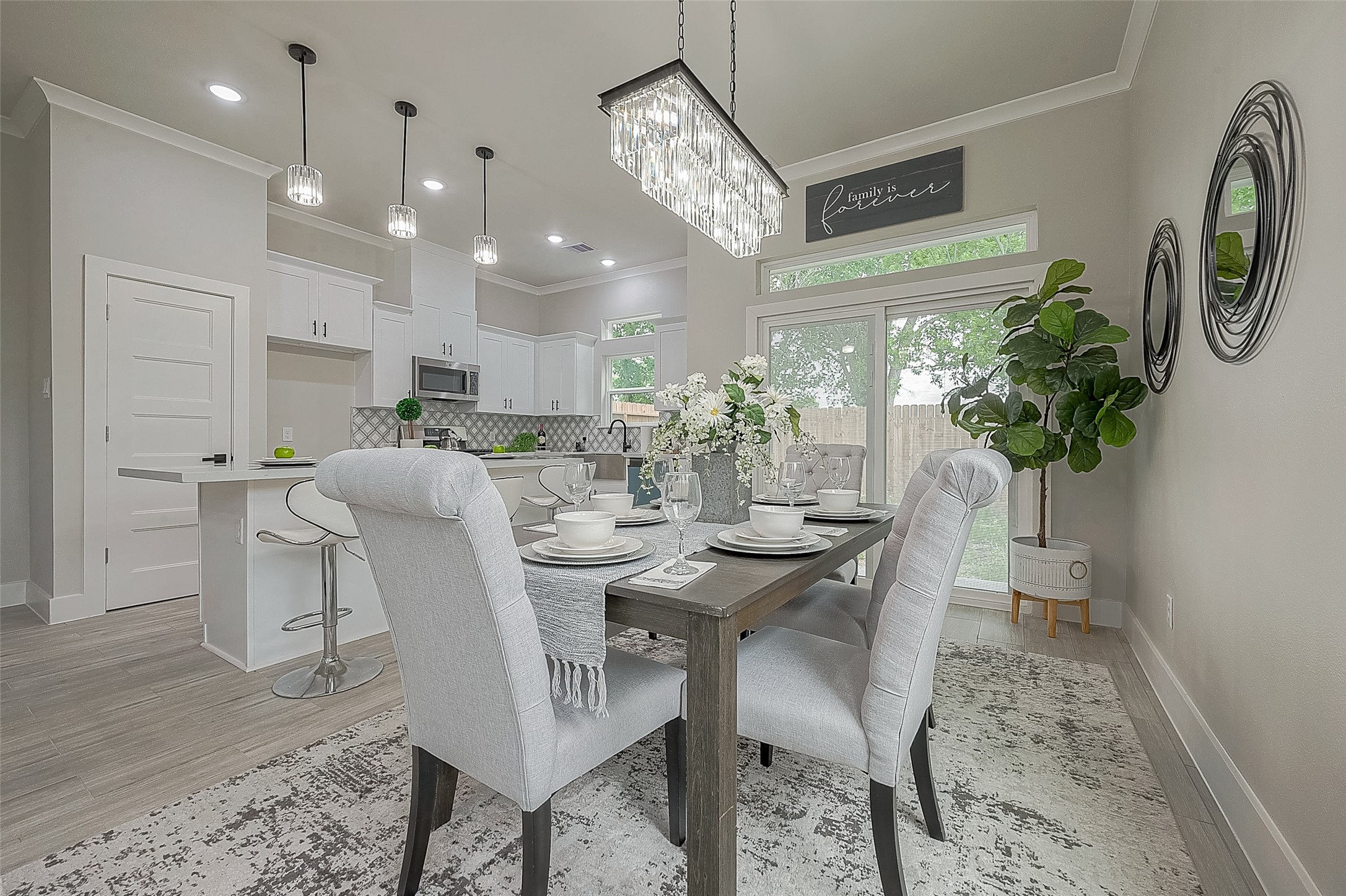 7108 St Augustine Street Houston, TX 77021 - Photo 5 of 21 a view of a dining room with furniture and a chandelier