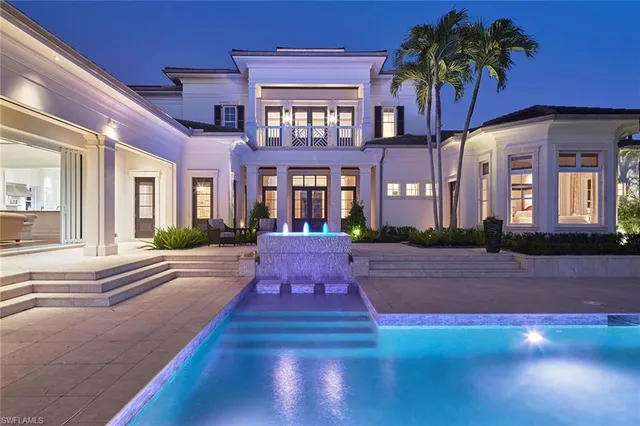 a view of a backyard with swimming pool