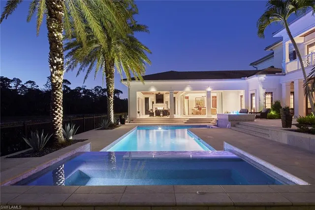 a kitchen with granite countertop lots of counter top space and stainless steel appliances