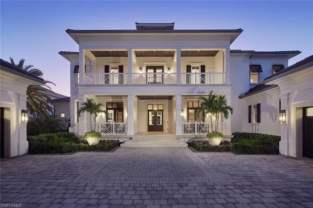 a view of a patio with table and chairs potted plants
