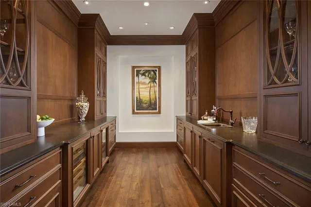 a dining room with furniture and a window