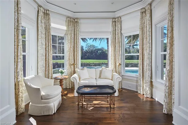 a spacious bathroom with a double vanity sink a mirror and a bathtub