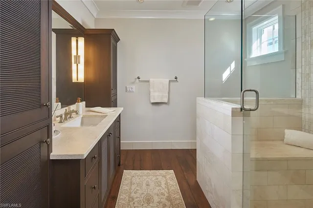 a bathroom with a double vanity sink and mirror