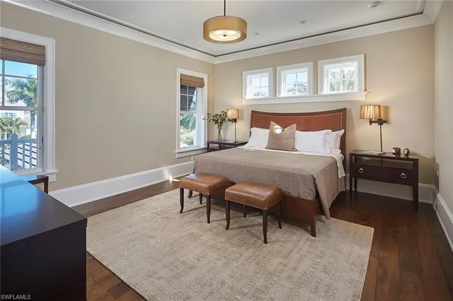 a bathroom with a granite countertop sink toilet and mirror