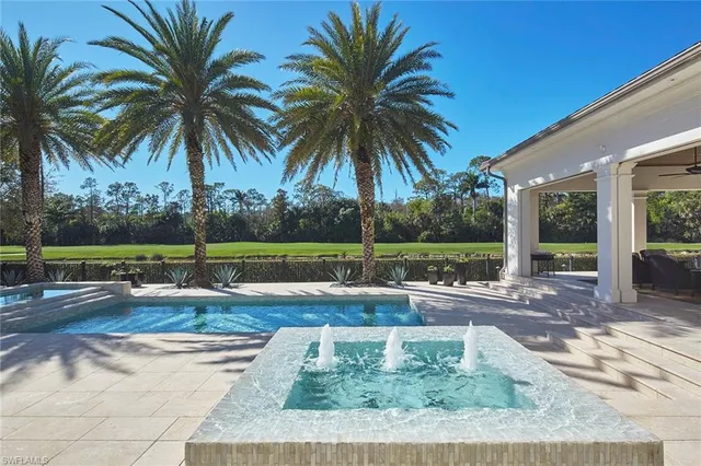 a front view of a house with yard and porch