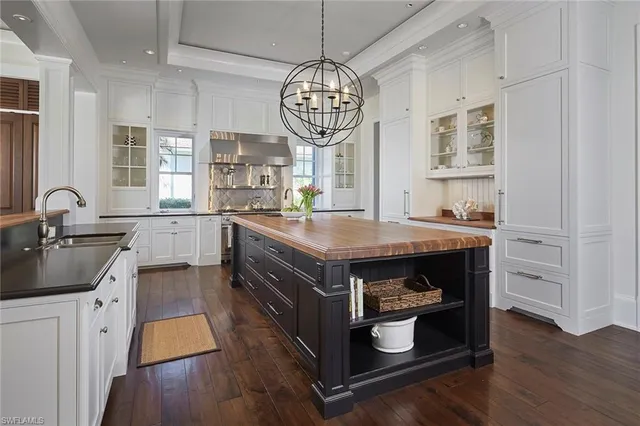 a kitchen with stainless steel appliances granite countertop a stove and a refrigerator
