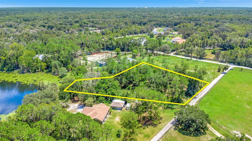 Debuel Road Lutz, FL 33549 - Photo 1 of 24 an aerial view of river residential houses with outdoor space and river