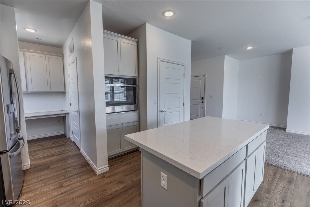 2555 Hampton Road, Unit 8206 Henderson, NV 89052 - Photo 8 of 35 This modern kitchen features a spacious island and sleek appliances, perfect for everyday living.