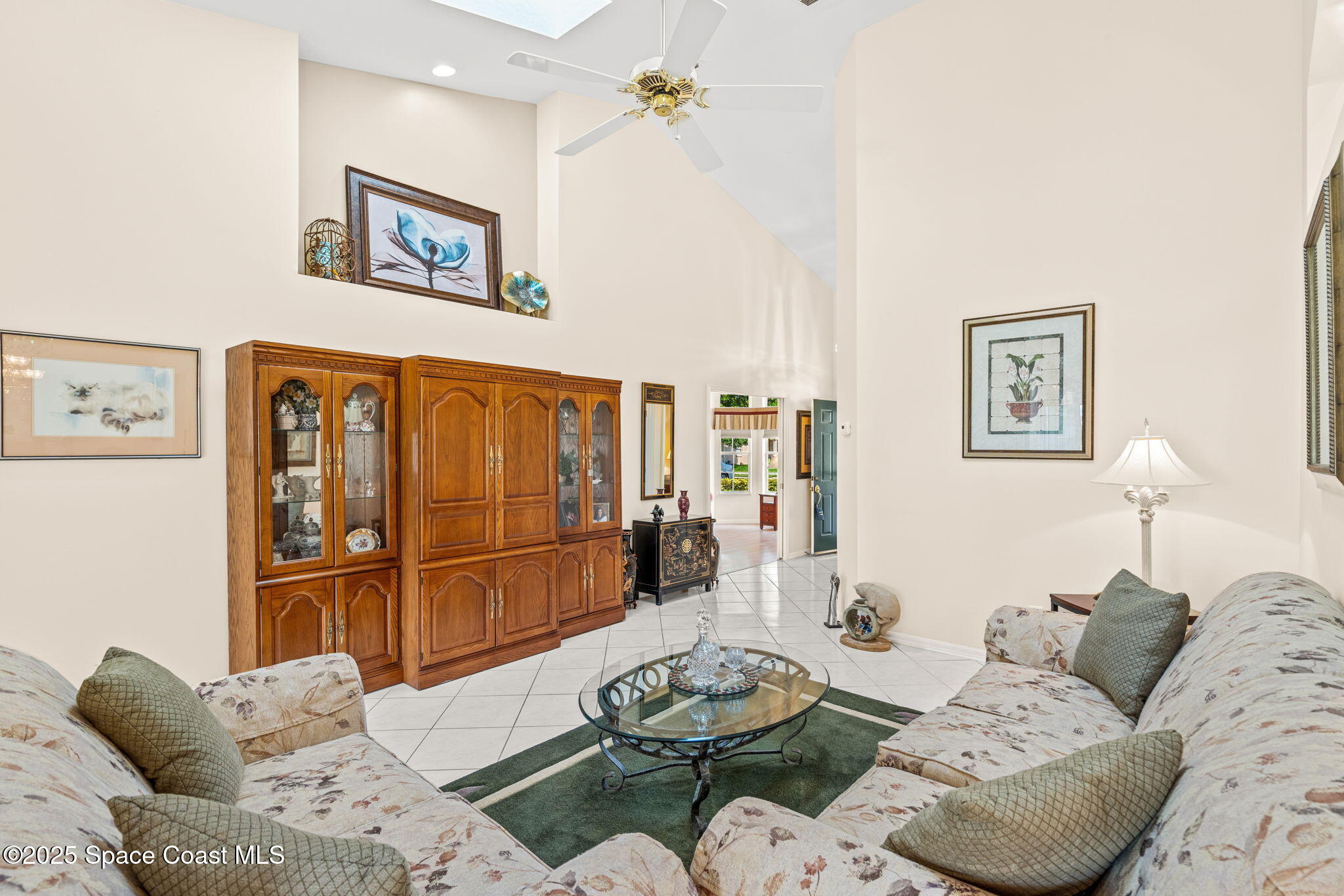 7702 Candlewick Drive Melbourne, FL 32940 - Photo 12 of 37 a living room with furniture and a window